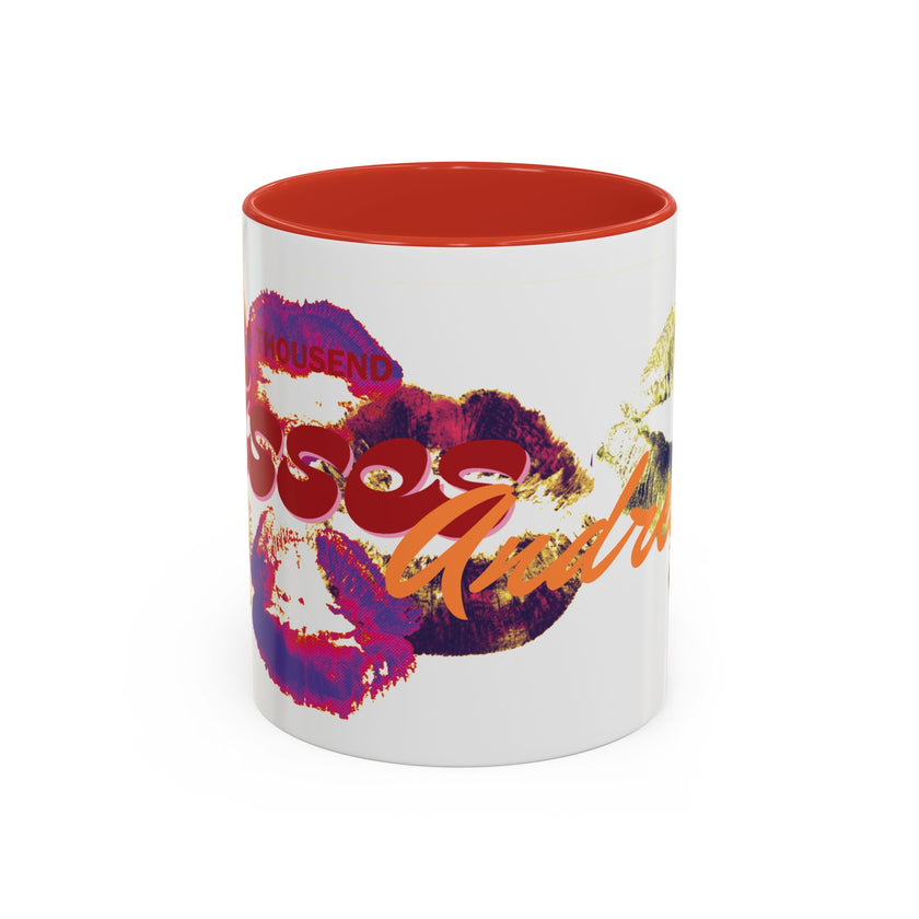 Add a playful touch to your collection with the Kiss Print Accent Coffee Mug — Personalized 'A Thousand Kisses' Pop-Art Lip Design (11oz), featuring vibrant kiss prints, bold text, and a striking red interior on a ceramic surface.