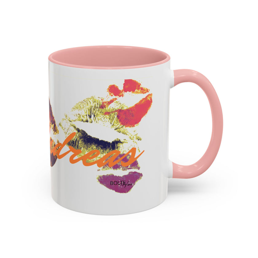 The Kiss Print Accent Coffee Mug (11oz) is a white ceramic mug with a pink handle and interior, featuring pop-art lip marks and 