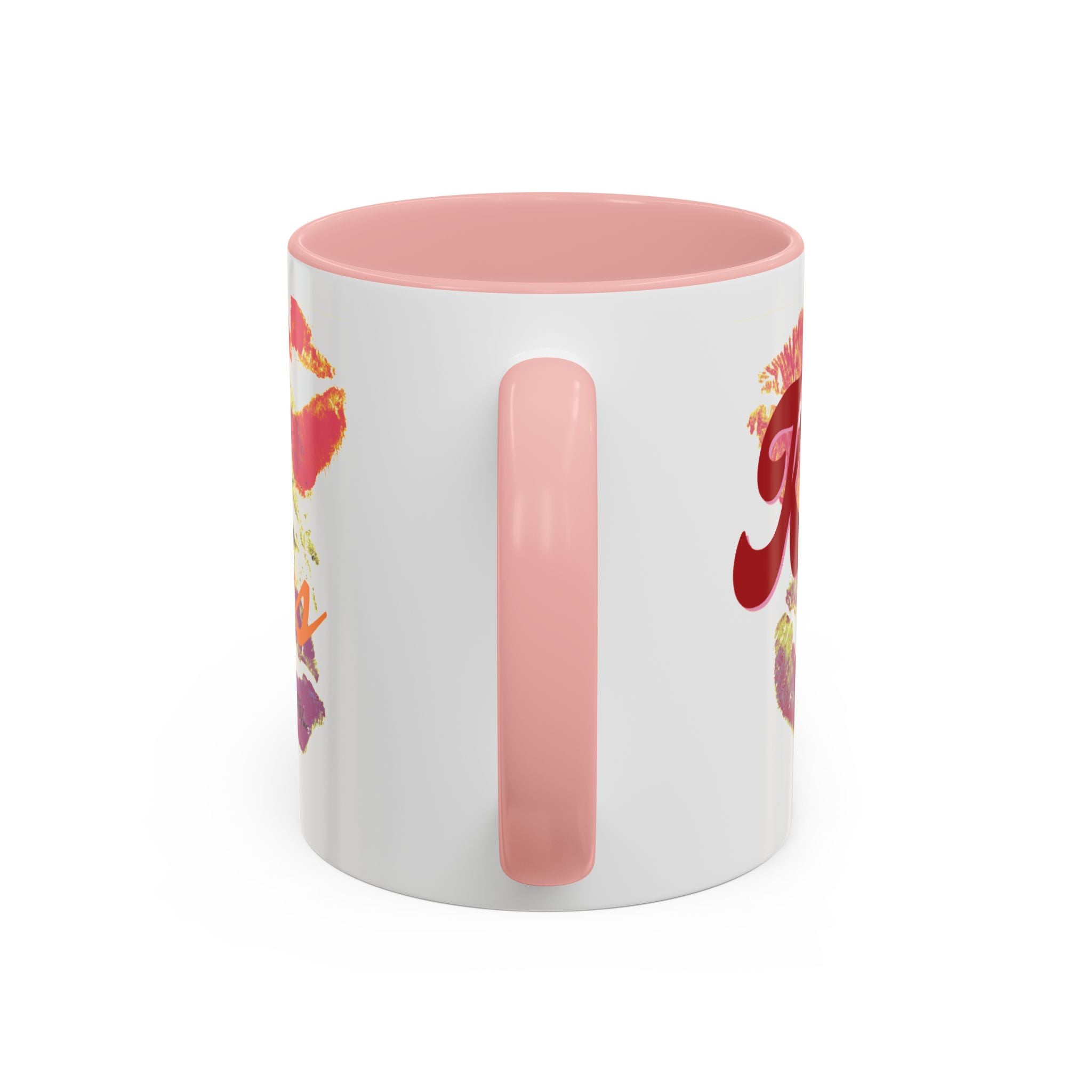 The Kiss Print Accent Coffee Mug — Personalized 'A Thousand Kisses' Pop-Art Lip Design (11oz) features a white ceramic base, pink handle and interior, playful pop-art lips with red cursive, and is dishwasher-safe for cheerful daily use.