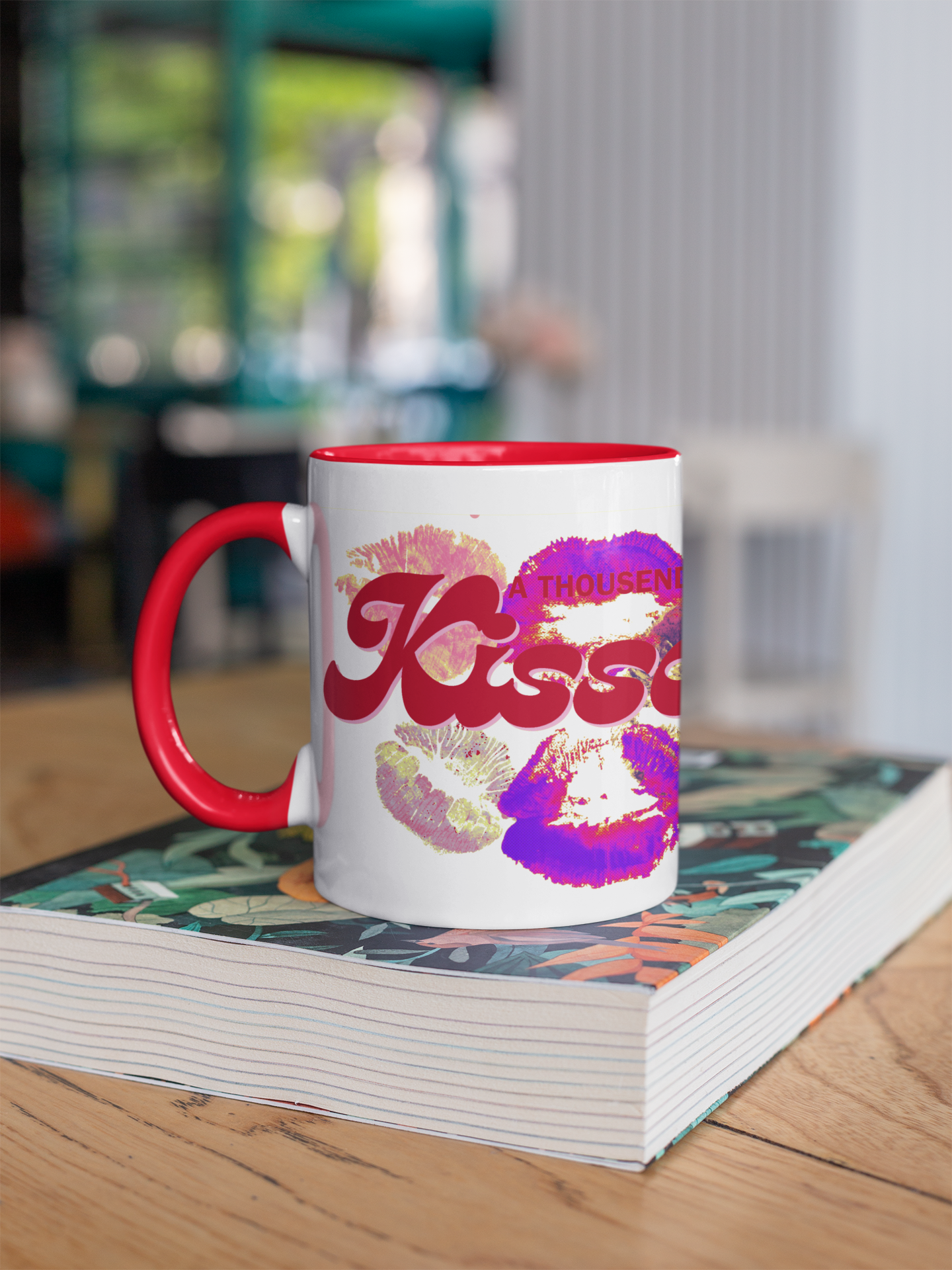 Mug with colorful design on a stack of books