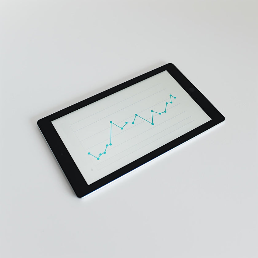 An Example product, a black tablet on a white surface, shows a line graph with blue data points indicating an upward trend with some fluctuations.