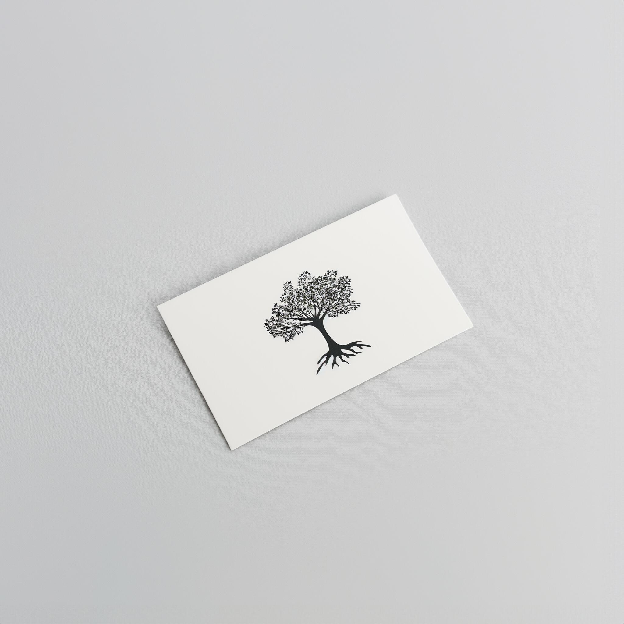 A white card from Example product rests on a light gray surface, featuring a simple black illustration of a tree with detailed branches and roots.
