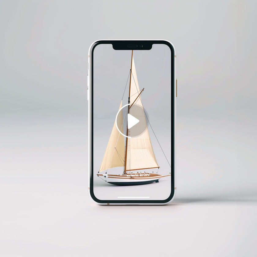 An upright Example product displays a video with a play button overlay, featuring a model sailboat with cream-colored sails set against a plain, light background.